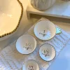 Inspire Me! Home Decor 4 Piece White With Gold Trim Measuring Cups