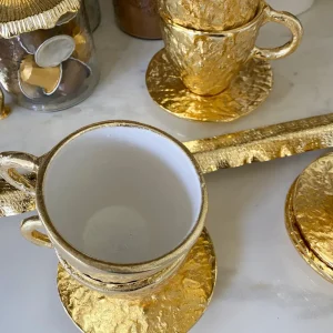 Inspire Me! Home Decor Gold Textured Metal Tea Cup And Saucer With White Interior