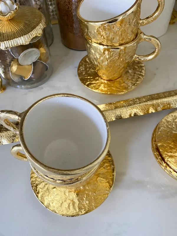 Inspire Me! Home Decor Gold Textured Metal Tea Cup And Saucer With White Interior